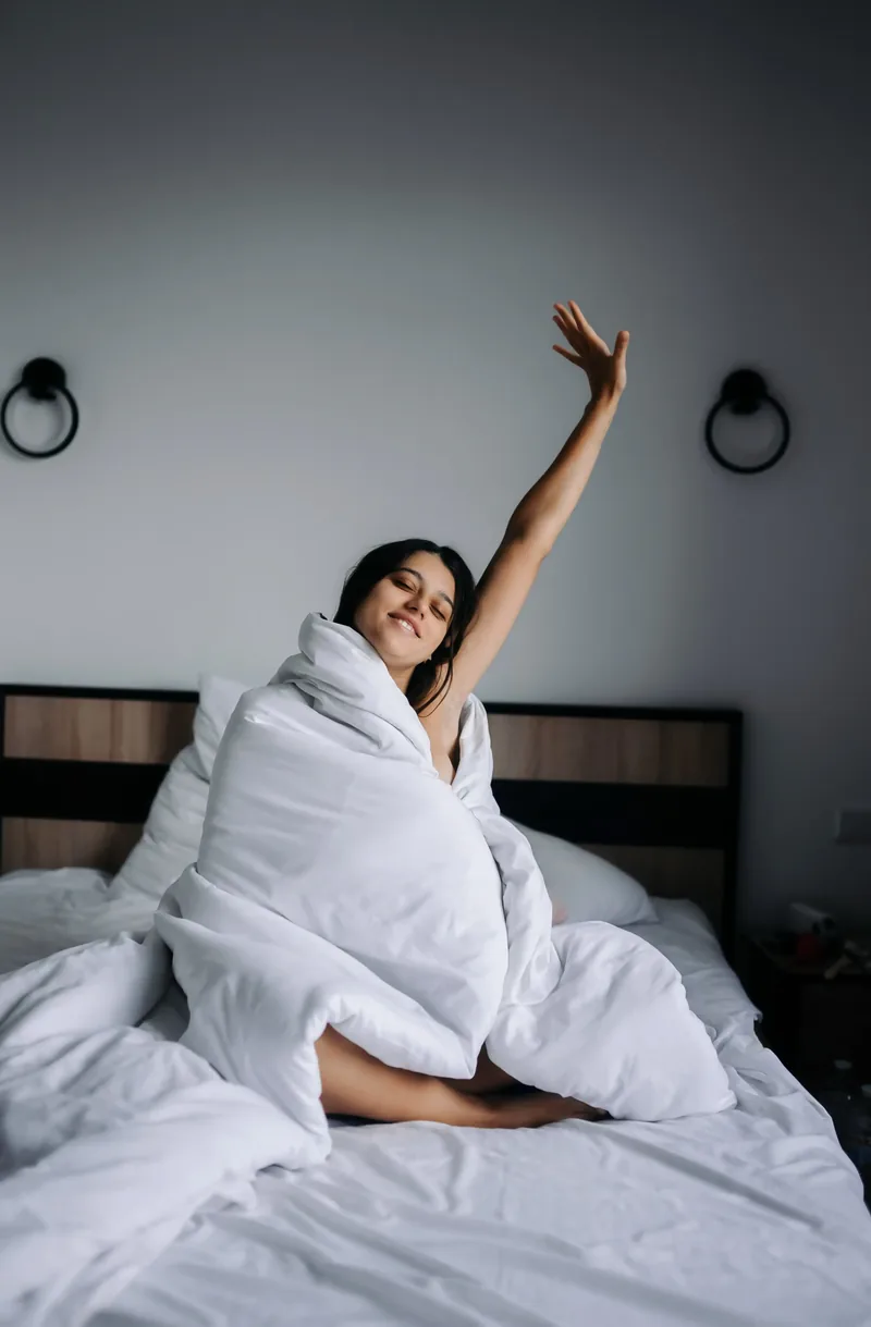 Woman stretching after good sleep